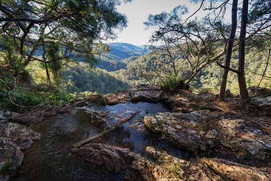View of Springbrook National Park from rocky ledge with natural pool