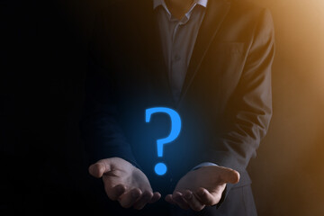 Businessman man hand hold interface question marks sign web. Ask quiestion online, FAQ concept,...