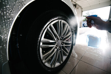 Car Wheels Cleaning with Special Stains and Oil Removing Detergent.