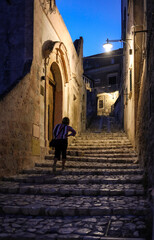  Typical cobbled stairs in a side street alleyway iin the Sassi di Matera a historic district in the city of Matera. Basilicata. Italy