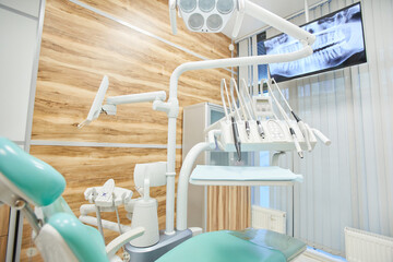 Image of empty chair for patient at modern dental clinic