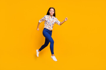 Fototapeta na wymiar Photo portrait full body view of cute running girl jumping up isolated on vivid yellow colored background