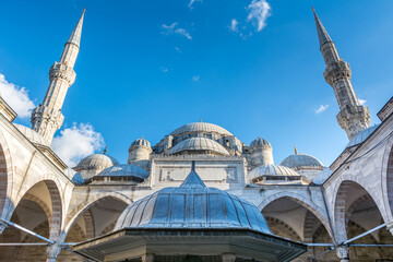Domes and minarets of Suleymaniye Mosque against blue sky in Istanbul, Turkey