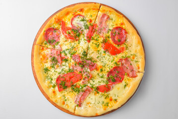 Pepperoni pizza on a white background. Traditional Italian pizza with tomatoes and meat isolated on white.