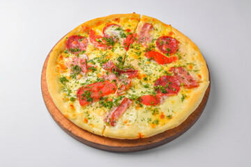Pepperoni pizza on a white background. Traditional Italian pizza with tomatoes and meat isolated on white.