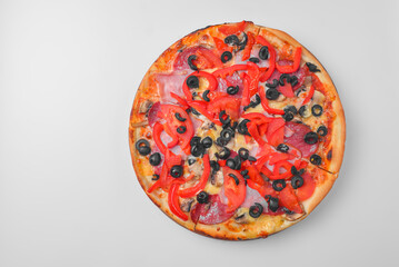 Pepperoni pizza on a white background. Traditional Italian pizza with tomatoes and olives isolated on white.