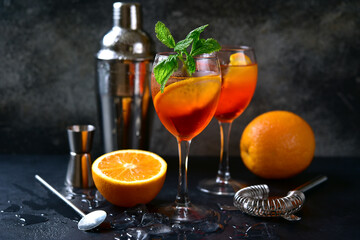 Delicious italian cocktail aperol spritz with orange.