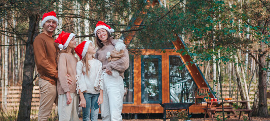 Beautiful family with kids walking at Christmas day