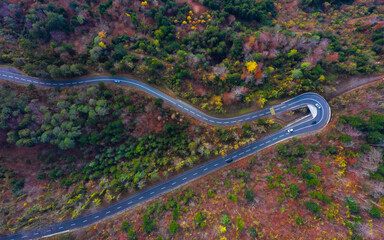 Curves road in the mountains. Autumn. Aerial view.