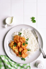 Vegan cauliflower curry with rice. Top view with copy space.