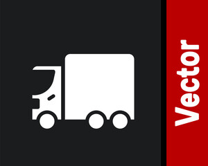 White Delivery cargo truck vehicle icon isolated on black background. Vector.
