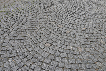 Old cobblestone pavement close-up.