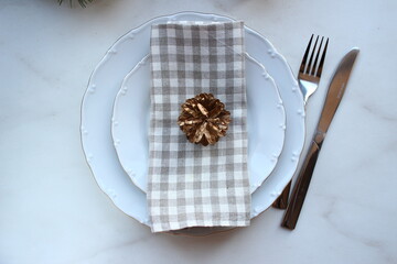 New Year's festive table setting, cutlery, decorations for the New Year's.
