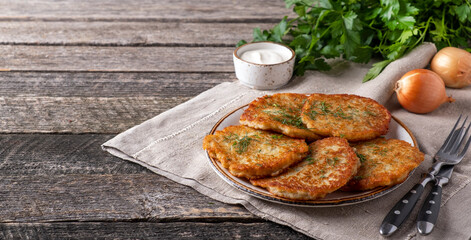 Potato pancakes with sour cream. Copy space