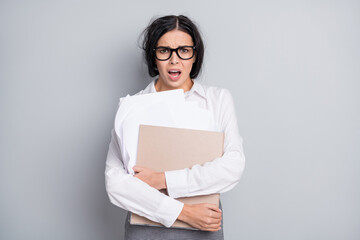 Photo of troubled mad girl hold folder paperwork open mouth wear eyewear white shirt isolated grey color background