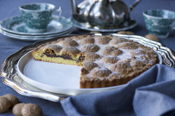 tea time with amaretti biscuits and plum jam cake