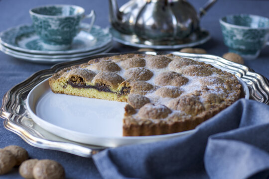 Tea Time With Amaretti Biscuits And Plum Jam Cake