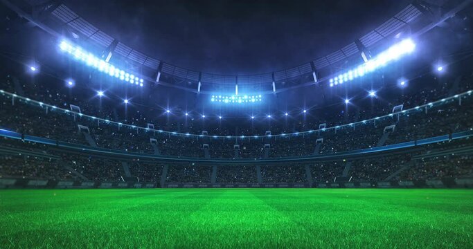 Green grass playground and stadium full of spectators and shining spotlights. Sport event as looped 4k video background.