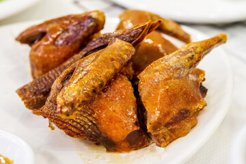 A classic Cantonese dish, braised pigeon, fried pigeon