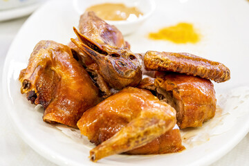 A classic Cantonese dish, braised pigeon, fried pigeon