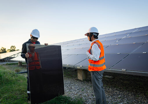 Technician is lifting the solar cell to replace the damaged one, Alternative energy to conserve the world's energy, Photovoltaic module idea for clean energy production