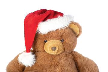 Teddy bear in christmas hat, isolated on white background.