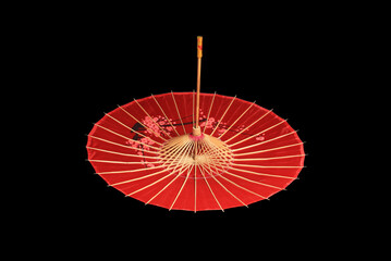 Chinese, Japanese, Oriental red umbrella on black background.