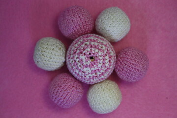 Beads on a pink background.