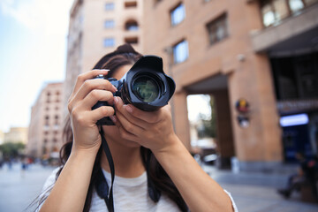 Woman photographer with a professional camera