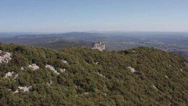 aerial view of a mountain and a big forest around, pic st loup summit in france, near to Montpellier 