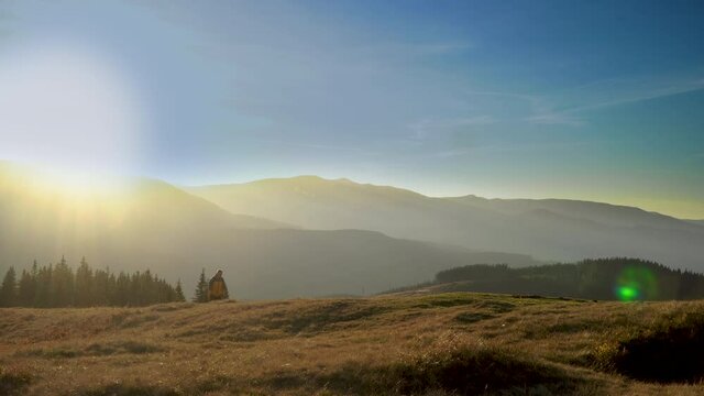A man travels in the mountains. Beautiful nature of the Carpathian mountains. The concept of travel and active lifestyle. 4K