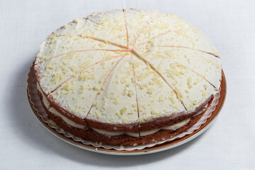 Naked layer cake with red velvet and chocolate biscuit and cream.