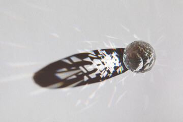 Glass geometric figures prisms with light diffraction of spectrum colors and complex reflection...