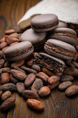 Macaroni with cocoa beans on a wooden table
