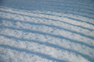 Abstract parallel shadows on snow in winter