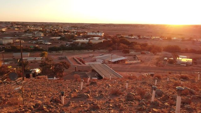 SUNSET aerial view of Coober Pedy town in Australia at twilight. Opal capital town of the world in South Australia
