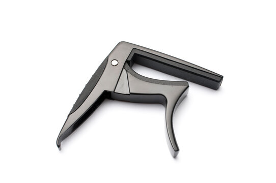 Black metal guitar capo isolated on white background