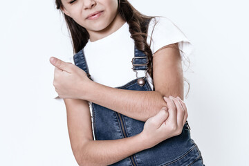 The girl has a pain in her arm.