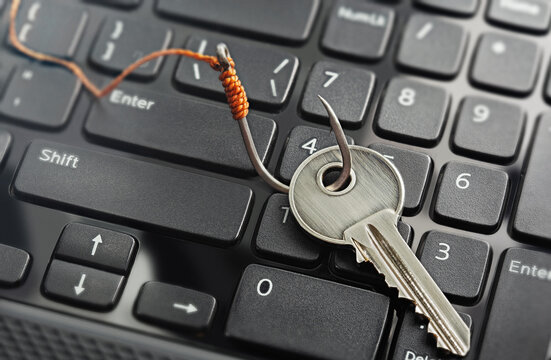 phishing, hacking personal data and money , key and hook on computer keyboard.