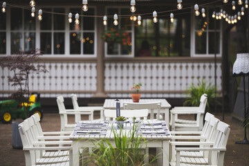 white table and chairs in a restaurant terrace 