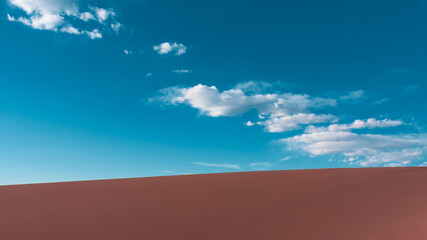 sand dune landscape with blue sky