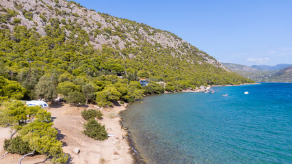 Peloponnese, Greece Aerial view on turqouise blue water and sandy beach. Limni Vouliagmeni or Ireon...