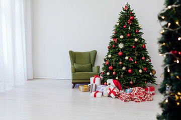 Christmas tree with presents underneath in living room
