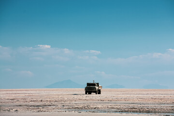 Truck transporting salt on Uyuni salt lake in Bolivia
