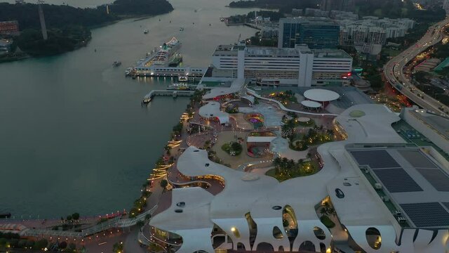 twilight illuminated singapore famous city mall sentosa traffic road aerial topdown panorama 4k 