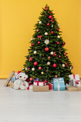 Perfect Christmas tree with gifts underneath in living room