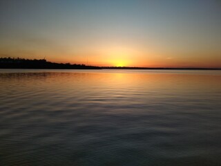 Obraz premium sunset over the river
