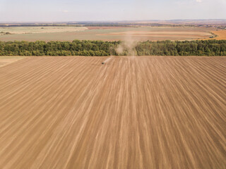 Fototapeta na wymiar nazvaniye Aerial View of Golden Wheat field. Agronomic firm