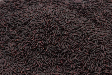 Uncooked Grains of Black Rice. Food background.