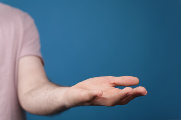 A man holding empty his hand